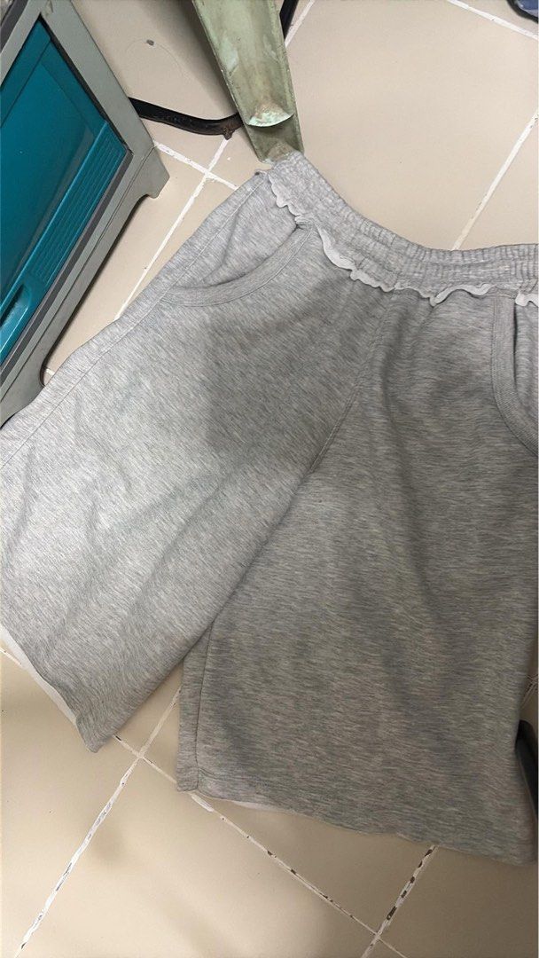 Grey Lounge Shorts with Scalloped Trim (Category: Shorts) located in Manila. Submitted by yurisgn (Listing ID 1460655872, Image 1). Description: - Comfy grey lounge shorts - Elastic waistband with cute scalloped trim - Side pockets for convenience - Made from soft fabric - Versatile for lounging or casual wear - Easy to pair with any top.
