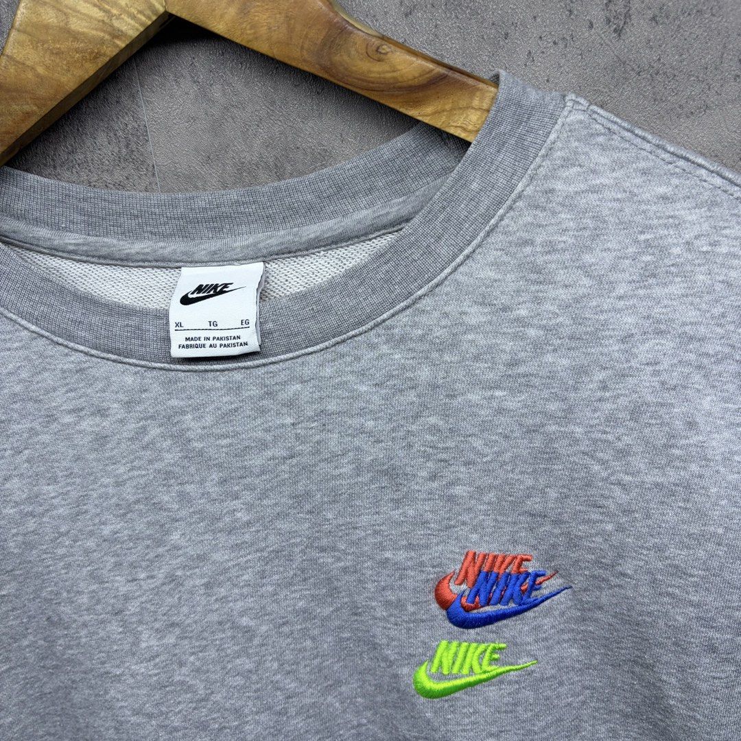 Grey Nike Crewneck Sweatshirt XL (Category: Coats, Jackets and Outerwear) located in Manila. Submitted by ruifinds (Listing ID 1460680180, Image 2). Description: -Nike Multi logo Contrasting Colors Round Neck Pullover Autumn Gray size: XL width: 24 length: 28 condition: excellent color rate: 9/10 Issues: none price: 700 + plus shipping fee - Grey Nike crewneck sweatshirt - Size: XL - Multi-colored embroidered Nike logo on chest - Small embroidere