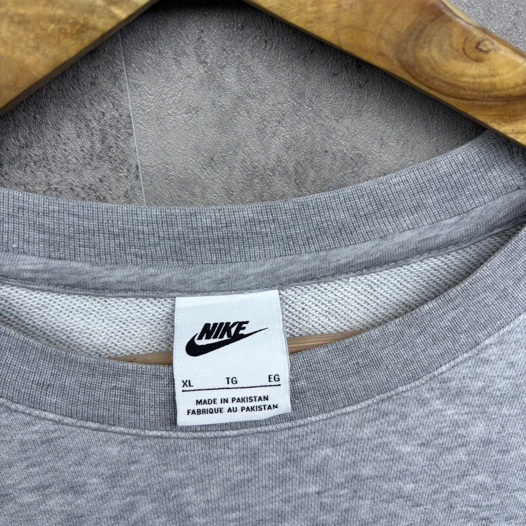 Grey Nike Crewneck Sweatshirt XL (Category: Coats, Jackets and Outerwear) located in Manila. Submitted by ruifinds (Listing ID 1460680180, Image 3). Description: -Nike Multi logo Contrasting Colors Round Neck Pullover Autumn Gray size: XL width: 24 length: 28 condition: excellent color rate: 9/10 Issues: none price: 700 + plus shipping fee - Grey Nike crewneck sweatshirt - Size: XL - Multi-colored embroidered Nike logo on chest - Small embroidere