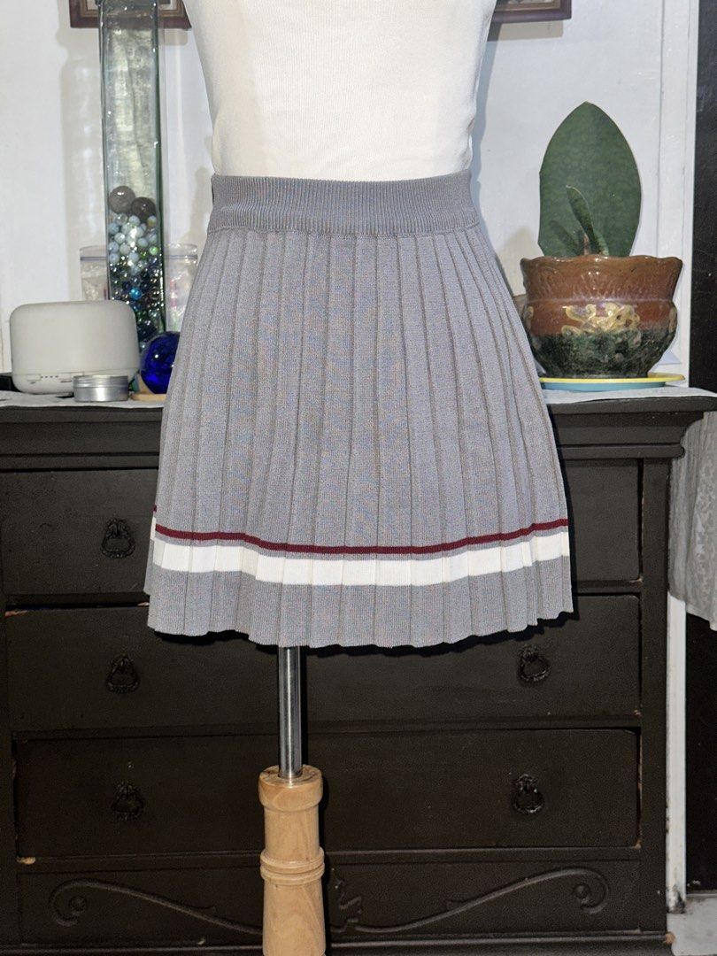 Grey Pleated Mini Skirt with Striped Hem (Category: Skirts) located in Quezon City. Submitted by marshyco (Listing ID 1460637717, Image 1). Description: - Cute grey pleated mini skirt - Ribbed waistband for comfort - Fun striped hem with white and maroon details.