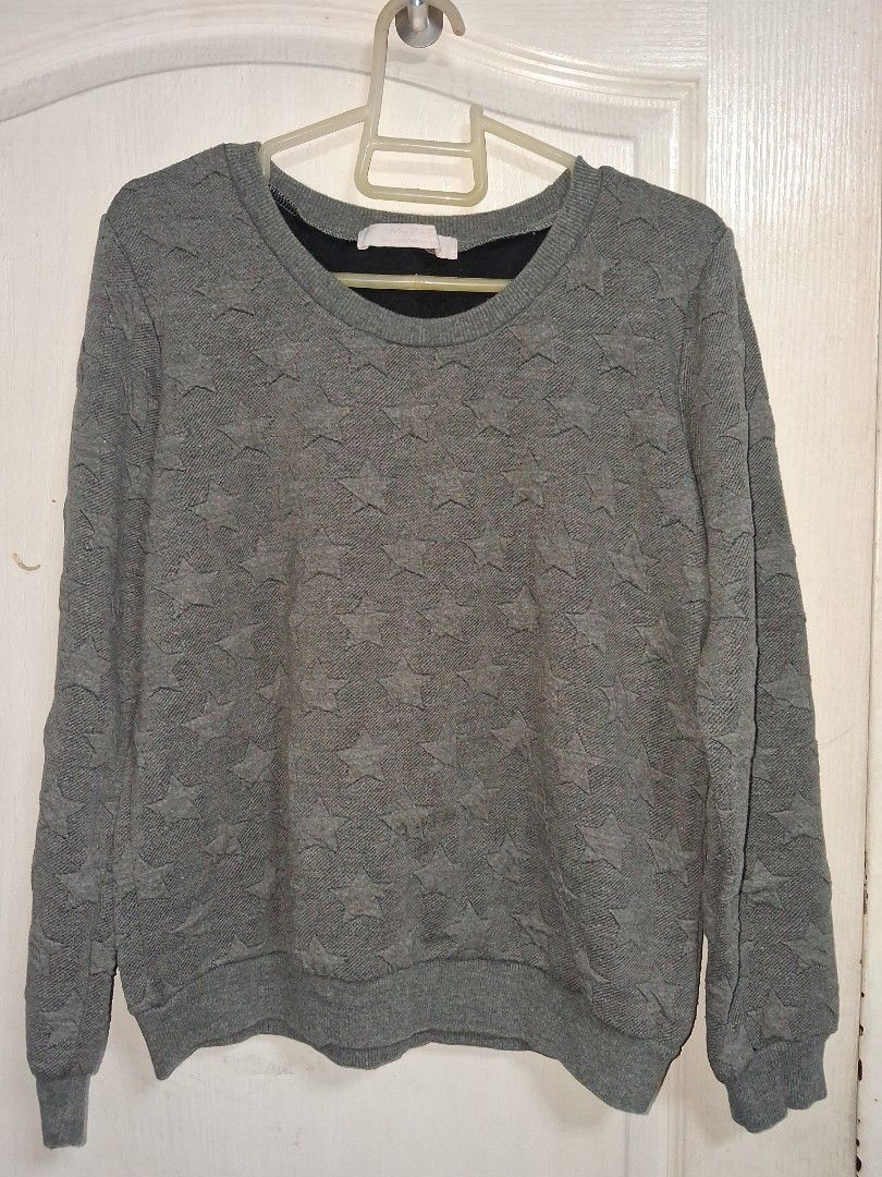 Grey Star Pattern Sweater (Category: Coats, Jackets and Outerwear) located in Baguio. Submitted by arowarwai (Listing ID 1460664894, Image 1). Description: - Grey knit sweater - Subtle all-over star pattern - Long sleeves - Crew neck - Comfortable and versatile for layering or standalone wear - Pairs easily with jeans or skirts.