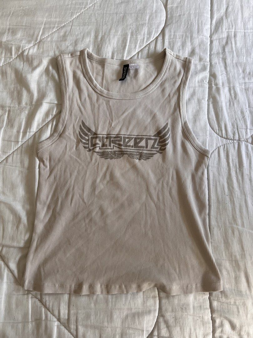 Greyish H&M Divided Graphic Tank Top (Category: Sleeveless) located in Taguig. Submitted by gingerderp (Listing ID 1460568697, Image 1). Description: Coolest tank, can be worn with so many different pieces! .