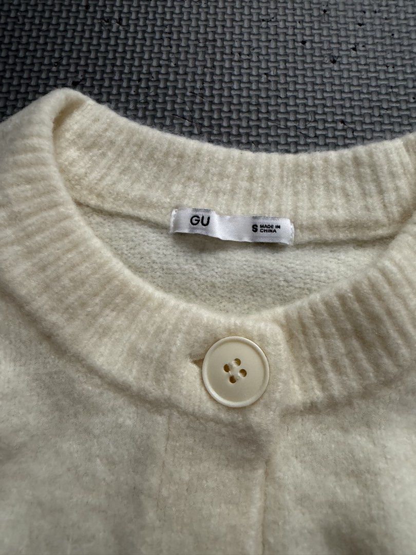 GU Cream Knit Button Up Cardigan Size S (Category: Coats, Jackets and Outerwear) located in Mabalacat. Submitted by tinedpsalvador_on_ig (Listing ID 1460641588, Image 2). Description: - GU Cream Knit Cardigan - Classic button-up front - Ribbed cuffs and hem - Soft and cozy material - Versatile for layering over tops or dresses - Easy to style for casual or dressed-up looks.