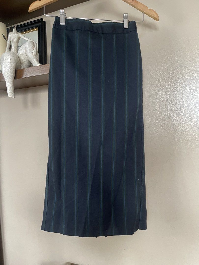 GU midi /pencil skirt (Category: Skirts) located in Quezon City. Submitted by booktt (Listing ID 1460649619, Image 2). Description: GU skirt small - a vertical striped midi/pencil skirt featuring a navy blue base with contrasting green and blue pinstripe detailing. It is tailored with a high-rise waist and a straight column silhouette..