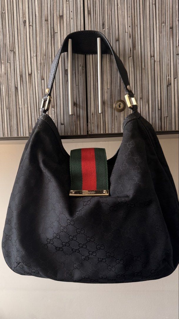 Gucci Black GG Monogram Canvas Hobo Bag (Category: Luxury Bags & Wallets) located in Quezon City. Submitted by andreamolly888 (Listing ID 1460694266, Image 1). Description: AUTHENTIC GUCCI BLACK GG MONOGRAM CANVAS HOBO BAG Iconic vintage hobo silhouette featuring Gucci’s signature Green/Red Web stripe closure and leather shoulder strap! 📌 ITEM DETAILS: Brand: Gucci Model: Vintage GG Monogram Canvas Web Hobo Color: Black Monogram / Green & Red We