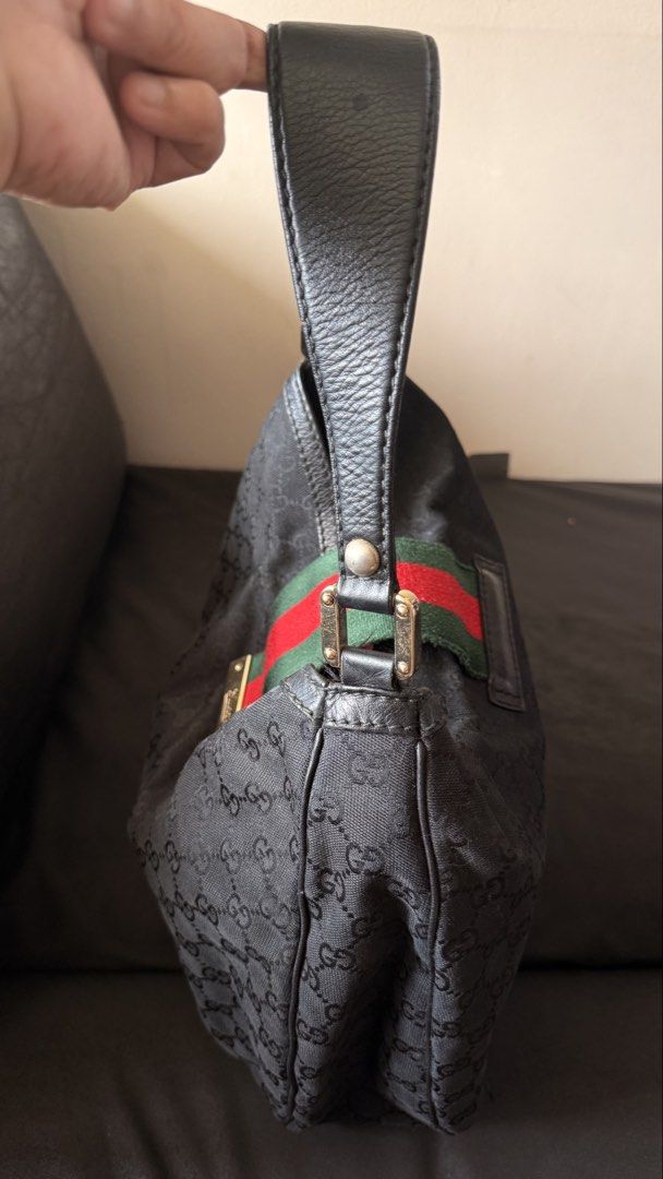 Gucci Black GG Monogram Canvas Hobo Bag (Category: Luxury Bags & Wallets) located in Quezon City. Submitted by andreamolly888 (Listing ID 1460694266, Image 2). Description: AUTHENTIC GUCCI BLACK GG MONOGRAM CANVAS HOBO BAG Iconic vintage hobo silhouette featuring Gucci’s signature Green/Red Web stripe closure and leather shoulder strap! 📌 ITEM DETAILS: Brand: Gucci Model: Vintage GG Monogram Canvas Web Hobo Color: Black Monogram / Green & Red We