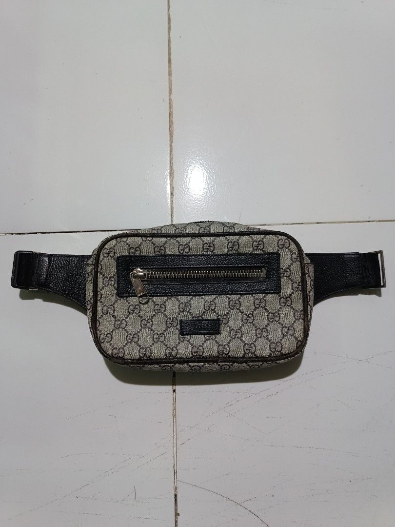 Gucci Monogram Belt Bag (Category: Luxury Bags & Wallets) located in Barotac Nuevo. Submitted by gray101 (Listing ID 1460638357, Image 1). Description: - Gucci belt bag - Classic GG monogram canvas - Black leather trim - Adjustable strap with metal buckle - Zipper closure - Fabric lining interior - Ideal for keeping essentials handy.