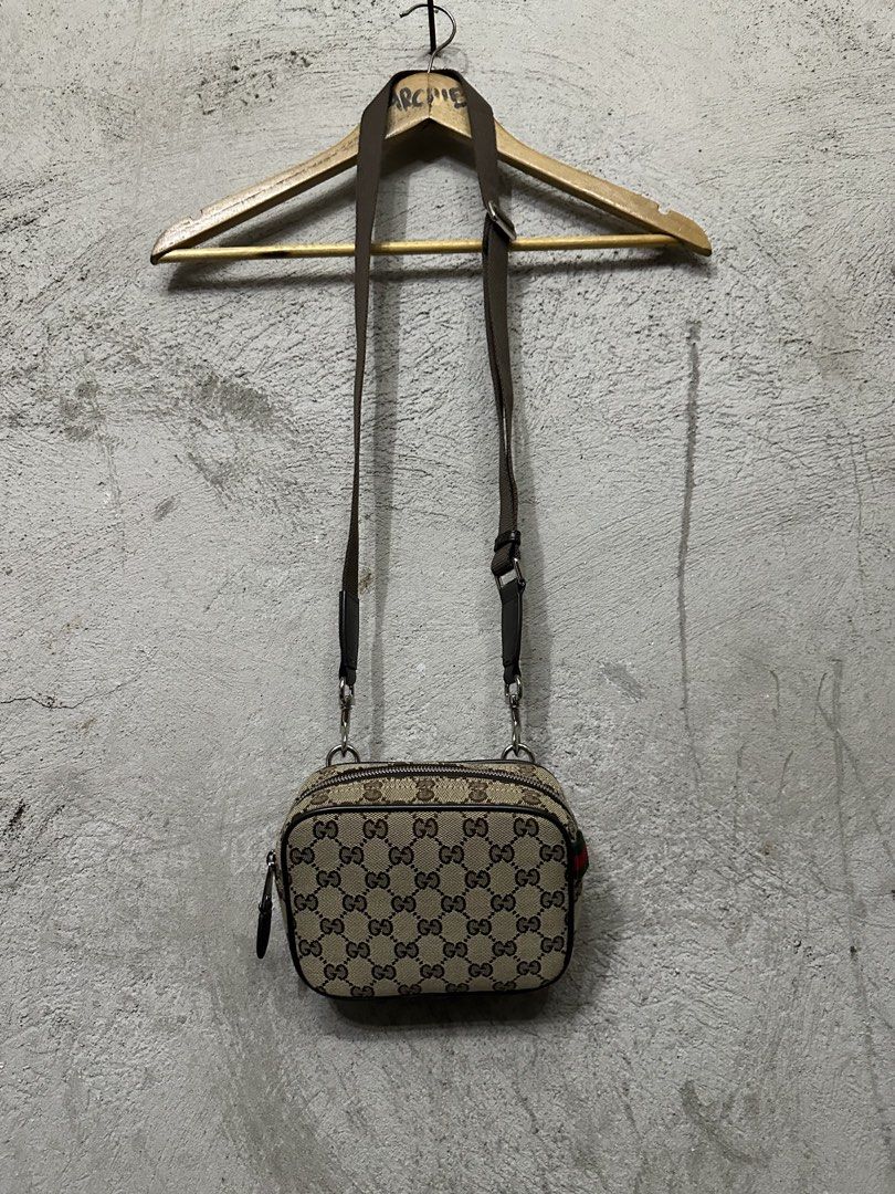 Gucci Monogram Canvas Crossbody Bag (Category: Luxury Bags & Wallets) located in Quezon City. Submitted by stre3tw3ar (Listing ID 1460524327, Image 1). Description: - Gucci crossbody bag - Classic GG monogram canvas with brown leather trim - Secure zip closure - Adjustable strap for comfortable wear - Compact size, ideal for carrying essentials - Signature green and red stripe detail - Back leather patch with Gucci logo - Coded .