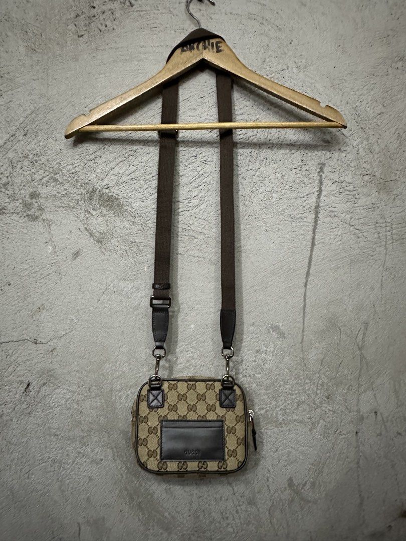 Gucci Monogram Canvas Crossbody Bag (Category: Luxury Bags & Wallets) located in Quezon City. Submitted by stre3tw3ar (Listing ID 1460524327, Image 2). Description: - Gucci crossbody bag - Classic GG monogram canvas with brown leather trim - Secure zip closure - Adjustable strap for comfortable wear - Compact size, ideal for carrying essentials - Signature green and red stripe detail - Back leather patch with Gucci logo - Coded .