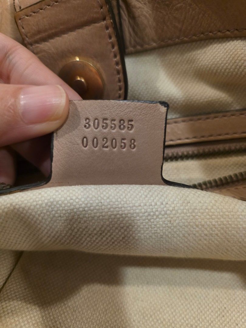 Gucci Monogram Canvas Tote Bag (Category: Luxury Bags & Wallets) located in Taytay. Submitted by brightdog.huskies (Listing ID 1460620573, Image 3). Description: - Authentic Gucci tote bag - Classic GG monogram canvas - Genuine leather trim and handles - Gold hardware details - Interior zip pocket - Serial number visible inside - Minor signs of wear on leather trim (bottom) and handles - Perfect for everyday use - Needs bag spa.