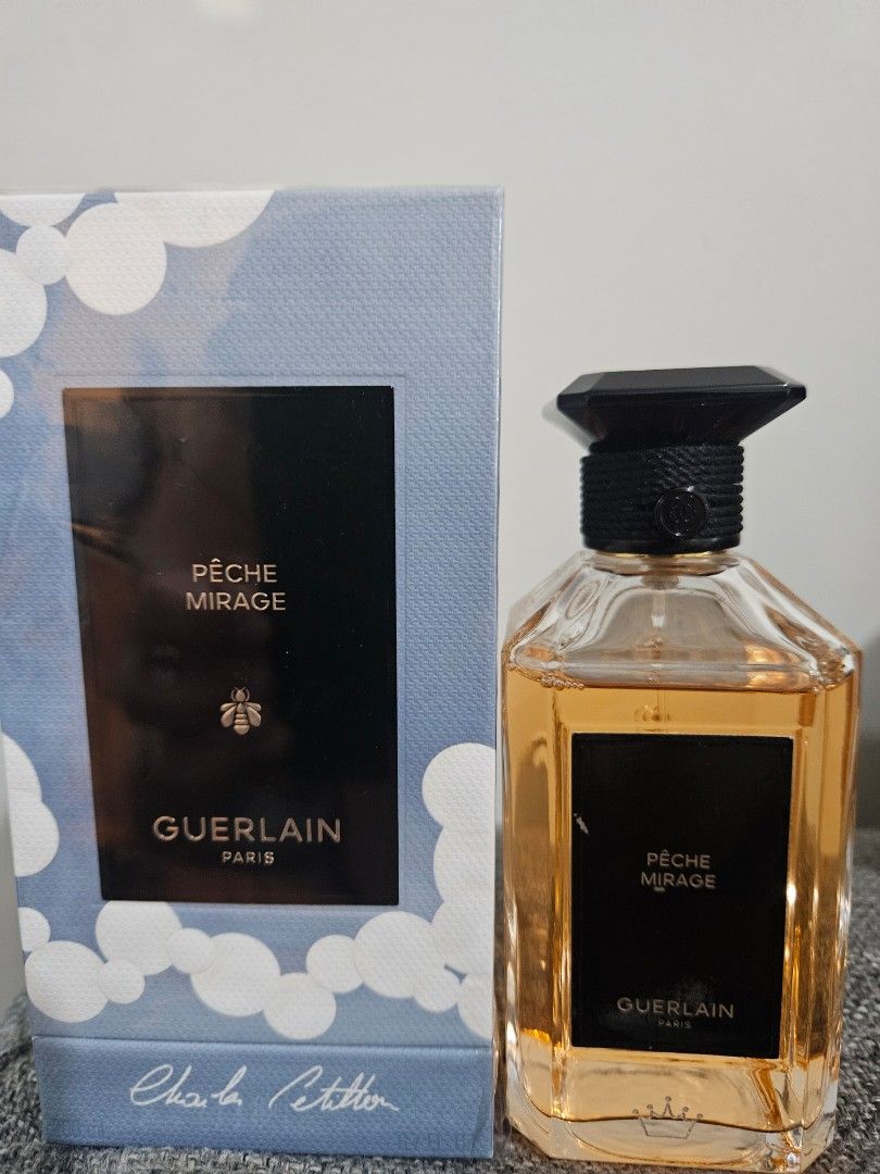 Guerlain Pêche Mirage Eau de Parfum 200ml (Category: Fragrance & Deodorants) located in Los Banos. Submitted by acleancloset (Listing ID 1460576049, Image 1). Description: - Guerlain Pêche Mirage Eau de Parfum - 200ml bottle, with engraved symbols in silver wax, label has some scratches - Authentic not a tester - Includes original box, batch code 4h01 no swaps, no layaways.