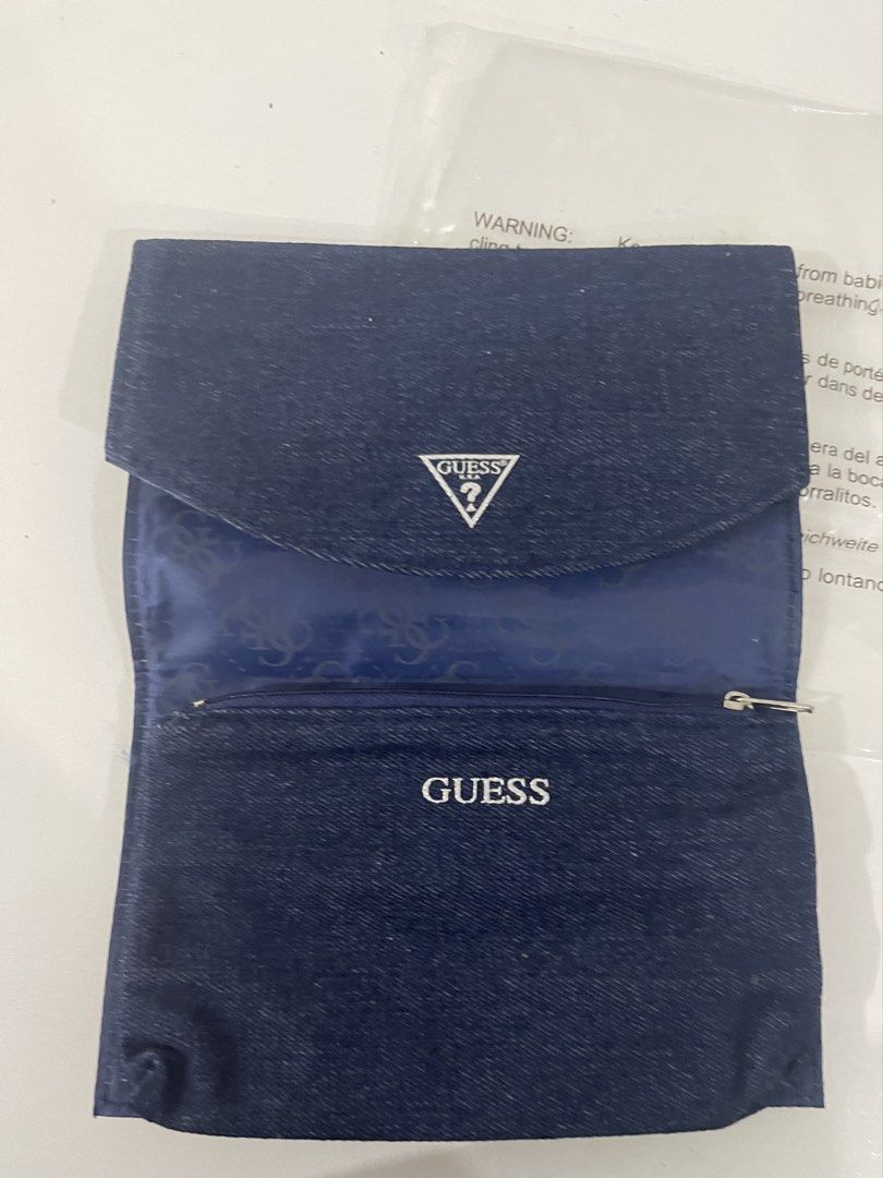 Guess Denim Pouch Organizer (Category: Purses & Pouches) located in Pasig City. Submitted by tinylittlestore (Listing ID 1460714605, Image 2). Description: - Original Guess Pouch - Guess dark wash denim pouch - Multiple interior compartments for organization - Zipper closure on one section - Snap button closure on the flap - Ideal for travel or everyday use - Keeps your essentials tidy.