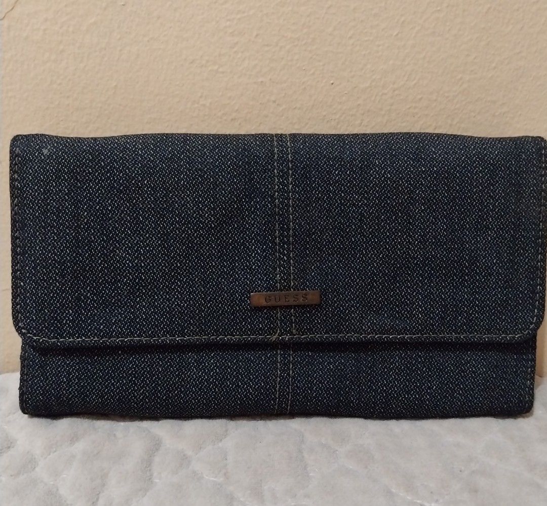 Guess Denim Wallet (Category: Wallets & Card holders) located in Manila. Submitted by PrinceDani.Clothing (Listing ID 1460567557, Image 2). Description: guess denim wallet 7.5in width 4.5in length issue: white stain back part excellent condition .