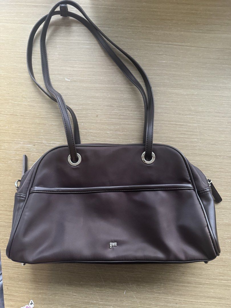 GVN Medium Nylon Bowler Bag in Espresso (Category: Shoulder Bags) located in Pasig City. Submitted by doo.clutta (Listing ID 1460697875, Image 1). Description: Medium bowler-style shoulder bag in a deep espresso brown with silver-tone hardware and long shoulder straps. Lightweight nylon exterior with structured piping, zip closure and roomy light-colored interior. Easy everyday bag that fits comfortably on the shoulder. Condition: Very good pre-o