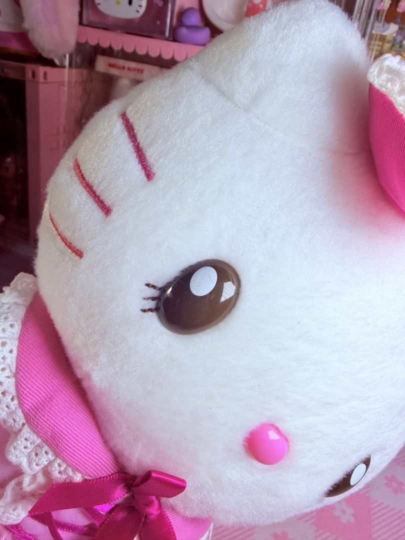 Hello Kitty USJ Strawberry (Category: Plushies & Soft Toys) located in Caloocan City. Submitted by fluffy.stuff10 (Listing ID 1460563805, Image 3). Description: - Adorable Kitty plush toy - Features a cute pink strawberry dress with lace trim - Decorated with charming bows on head and dress - Complete with shiny pink shoes - Perfect addition to any Kitty collection - Great for display purposes.