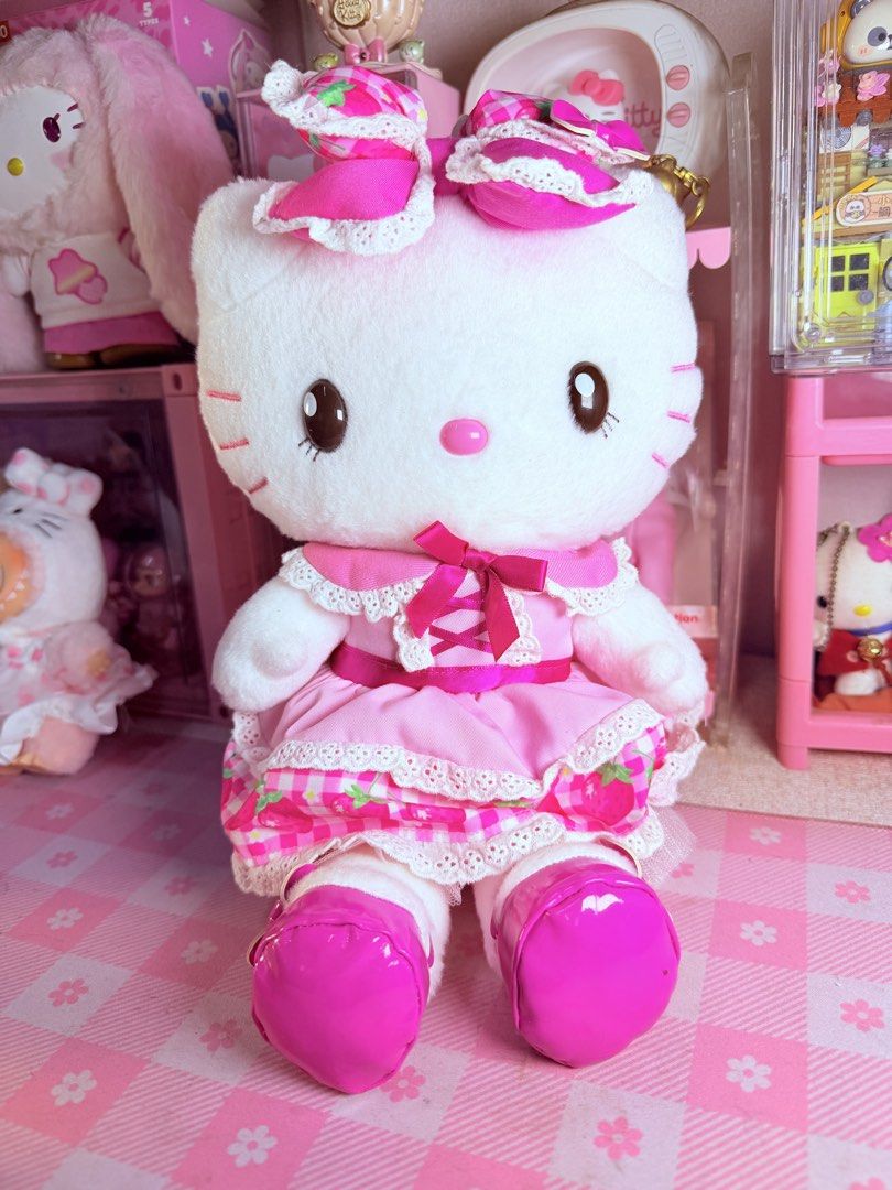 Hello Kitty USJ Strawberry (Category: Plushies & Soft Toys) located in Caloocan City. Submitted by fluffy.stuff10 (Listing ID 1460563805, Image 1). Description: - Adorable Kitty plush toy - Features a cute pink strawberry dress with lace trim - Decorated with charming bows on head and dress - Complete with shiny pink shoes - Perfect addition to any Kitty collection - Great for display purposes.