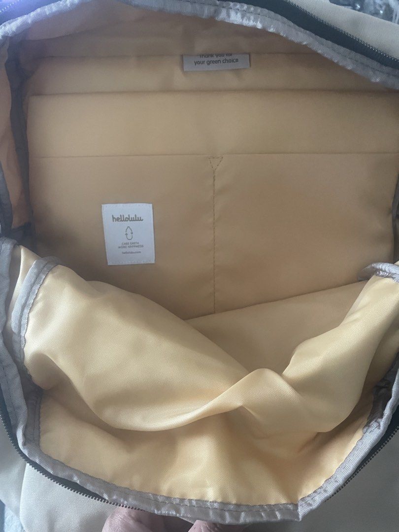 hellolulu Beige Backpack (Category: Backpacks) located in Pasay City. Submitted by tropak_mo (Listing ID 1460565933, Image 2). Description: - Beige hellolulu backpack - Front pocket with magnetic closure - Multiple interior compartments, including a padded laptop sleeve - Side pockets for water bottles - Adjustable straps for comfort - Ideal for daily use or travel.