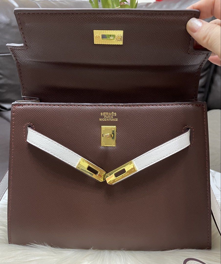 Hermes Kelly (Category: Cross-body Bags) located in Mandaue City. Submitted by ludz_0246 (Listing ID 1460645990, Image 3). Description: Coded Dustbag Gold Hardware Top Handle Coffee brown and white combination Two Way Engraved Logo In 25cm .