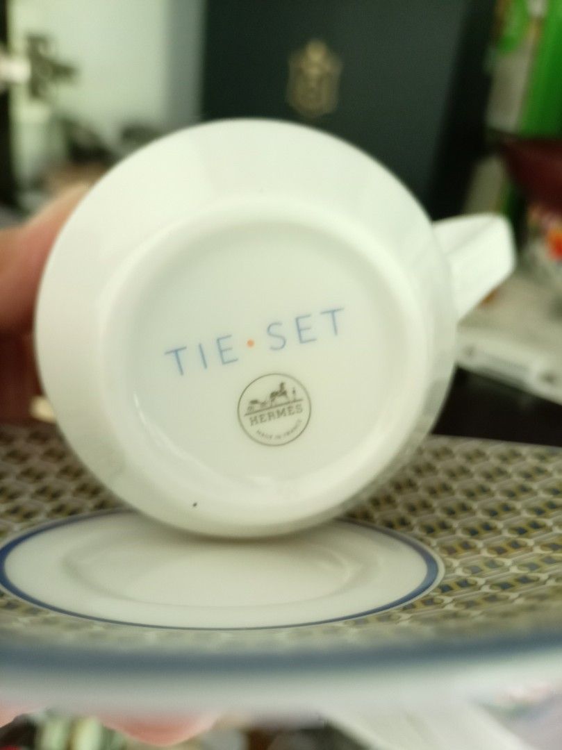 Hermes Tie Set Coffee Cup and Saucer Set (Category: Coffee & Tea Tableware) located in Makati City. Submitted by meowmyella (Listing ID 1460642857, Image 2). Description: - Hermes coffee cup and saucer set - From the elegant Tie Set collection - Features iconic blue and gold chain link pattern - Crafted in France - Comes with original Hermes box - Ideal for espresso or coffee enthusiasts authenticity not guaranteed. i bought this on line. .