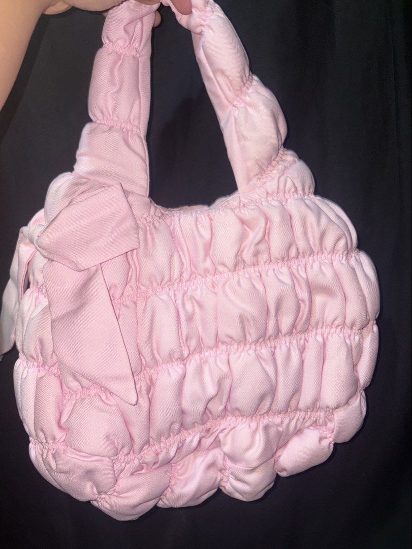 Heure141 THE PUFFER BOW MINI BAG (Category: Shoulder Bags) located in Taguig. Submitted by jjxcart (Listing ID 1460626670, Image 1). Description: Pink Dimensions: 12x9x7 Made from 100% premium polyester Inner lining: double lined with sturdy canvas fabric and polyester, sewn & combined Features a magnetic closure, 35cm long singular strap handle, and an inside pocket Handmade and designed in the Philippines. Hand-wash only. Haven’t been used RF: 