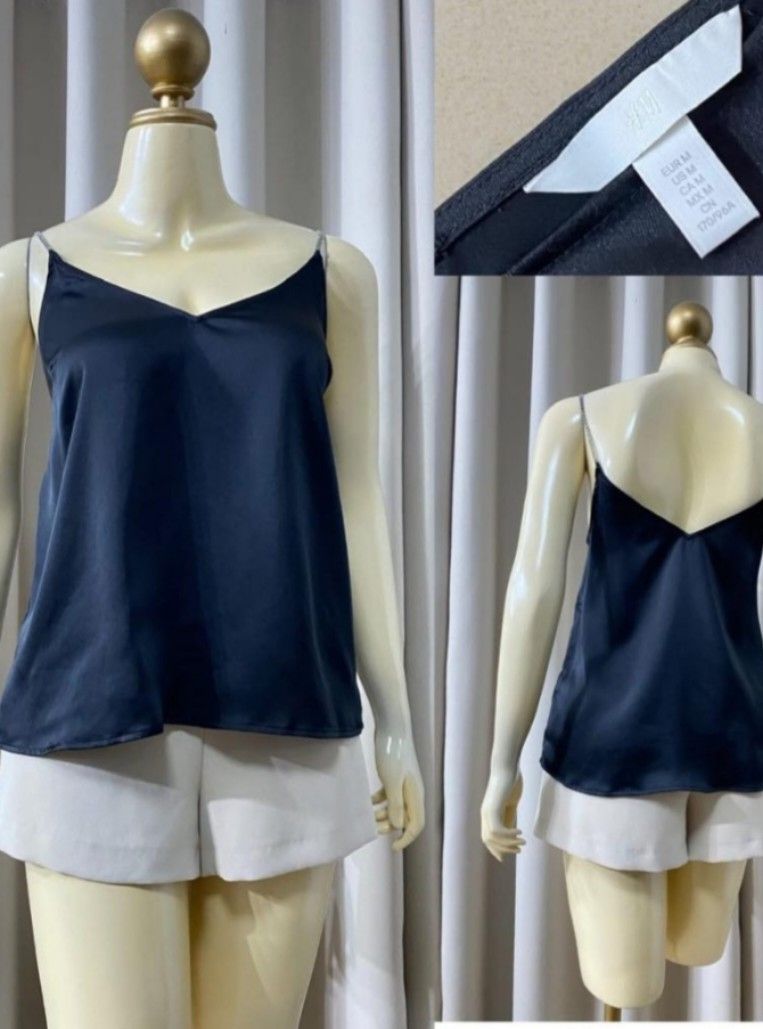 H&M Black V-Neck Camisole Top Medium (Category: Sleeveless) located in Antipolo. Submitted by hesedfinds.shop (Listing ID 1460601222, Image 1). Description: - Brand: H&M - Color: Black - Style: Camisole top - Neckline: V-neck - Straps: Delicate chain straps - Fabric: Has a nice sheen - Size: Medium - Occasion: Perfect for casual outings or a night out - Styling: Looks great paired with shorts or skirts.