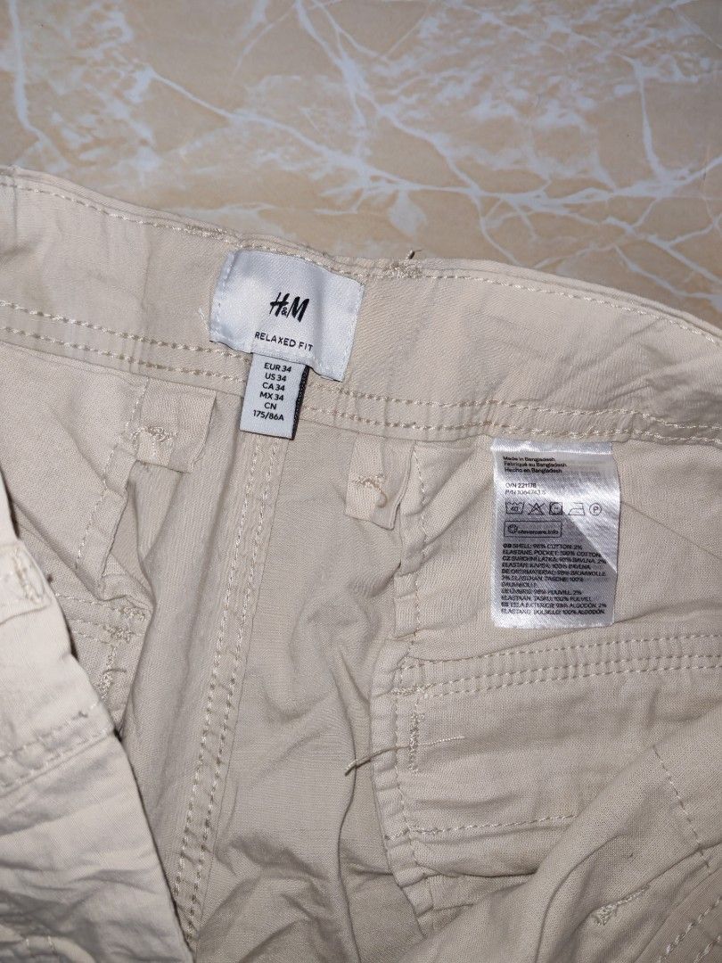 H&M cargo pants (Category: Chinos) located in Cotabato. Submitted by rayhan.thriftee (Listing ID 1460548016, Image 3). Description: h&m cargo pants light khaki brown 6 pocket 32-34 waistline 41 length good as new no issue.