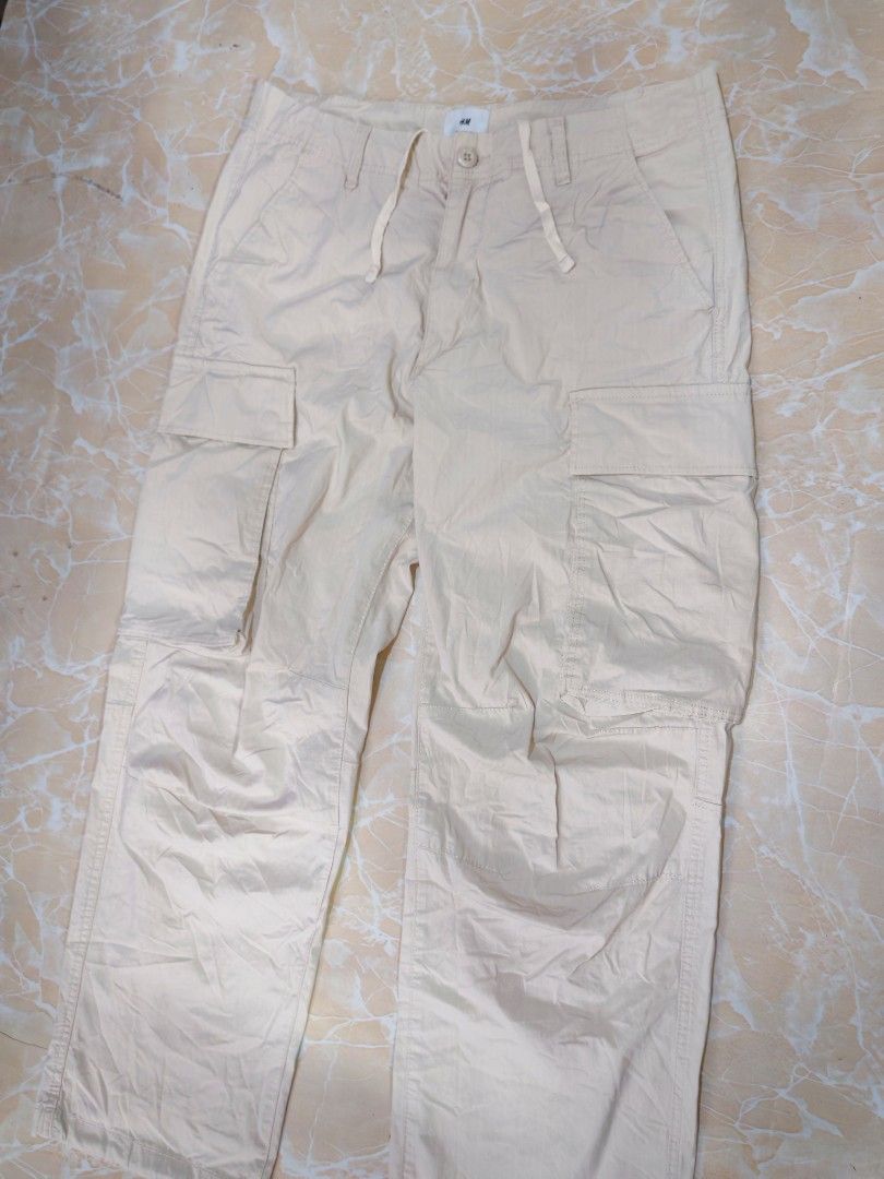 H&M cargo pants (Category: Chinos) located in Cotabato. Submitted by rayhan.thriftee (Listing ID 1460548016, Image 2). Description: h&m cargo pants light khaki brown 6 pocket 32-34 waistline 41 length good as new no issue.
