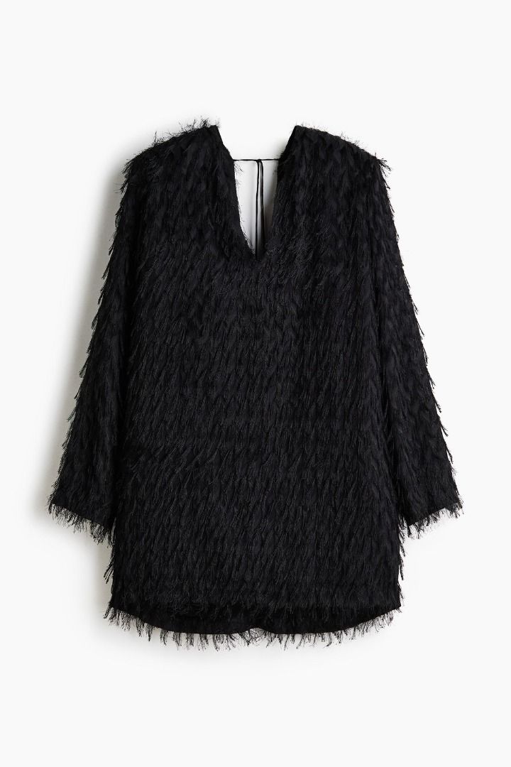 H&M Fringe Dress (Category: Dresses) located in Quezon City. Submitted by declutter_e (Listing ID 1460621942, Image 2). Description: Used only once for a work event. Details: - Stunning black mini dress - Unique fringed texture - Flattering deep V-neckline - Elegant low V-back with tie detail - Chic Bought for P2990 Selling for P1300 (still negotiable) I can provide a personal photo; just send me a message 🙂.
