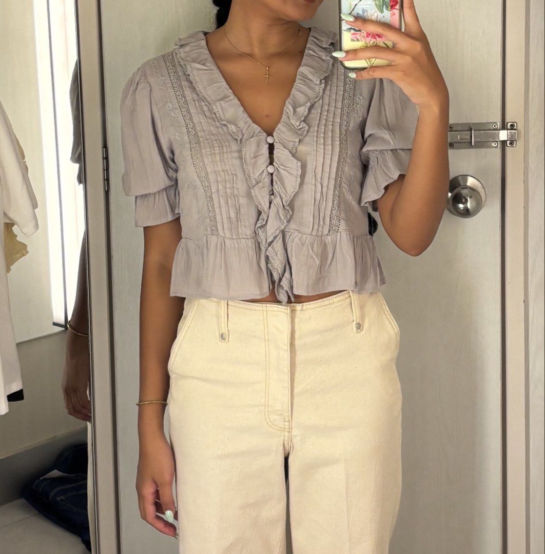 H&M Ruffle-Trimmed Blouse (Category: Blouses) located in Las Pinas. Submitted by namimihrt (Listing ID 1460696619, Image 3). Description: Unused, just tried on once, sold out, H&M ruffle trimmed top. Size XS. Originally bought for PHP 999. Selling because no longer needed corporate appropriate attire..