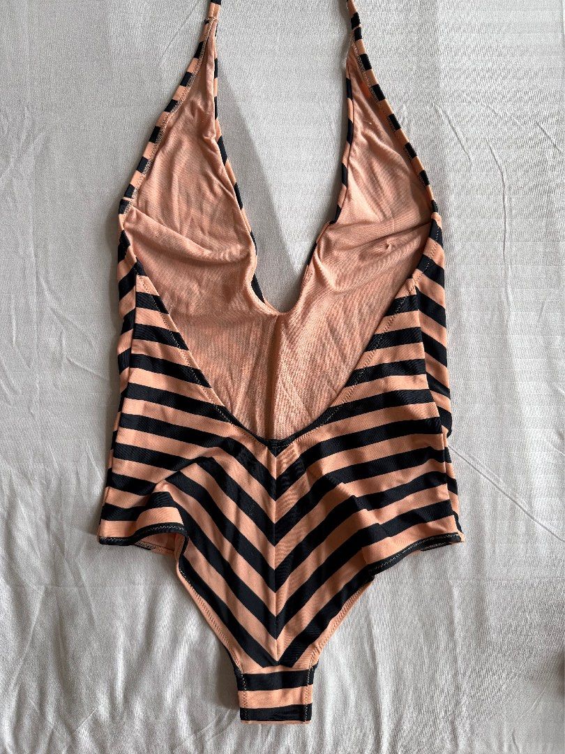 H&M Striped One-Piece Swimsuit (Category: Bikinis & Swimsuits) located in Antipolo. Submitted by brebekah (Listing ID 1460561569, Image 2). Description: - Cute H&M one-piece swimsuit - Not padded - Black and tan stripe pattern - Halter neck tie - Size: 4 (EUR 34, US 4, CA 4) - Made in Indonesia - Ideal for beach or pool days RFS No longer fits me.