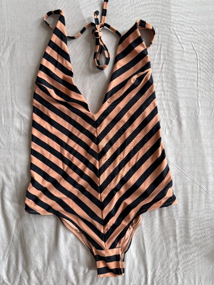 H&M Striped One-Piece Swimsuit (Category: Bikinis & Swimsuits) located in Antipolo. Submitted by brebekah (Listing ID 1460561569, Image 1). Description: - Cute H&M one-piece swimsuit - Not padded - Black and tan stripe pattern - Halter neck tie - Size: 4 (EUR 34, US 4, CA 4) - Made in Indonesia - Ideal for beach or pool days RFS No longer fits me.
