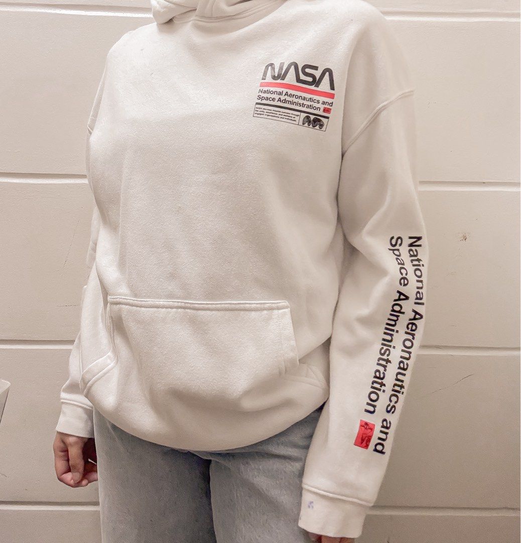 H&M White NASA Hoodie (Category: Hoodies) located in Manila. Submitted by jemmmandes (Listing ID 1460561313, Image 2). Description: - White hoodie by H&M - with ballpen marks.