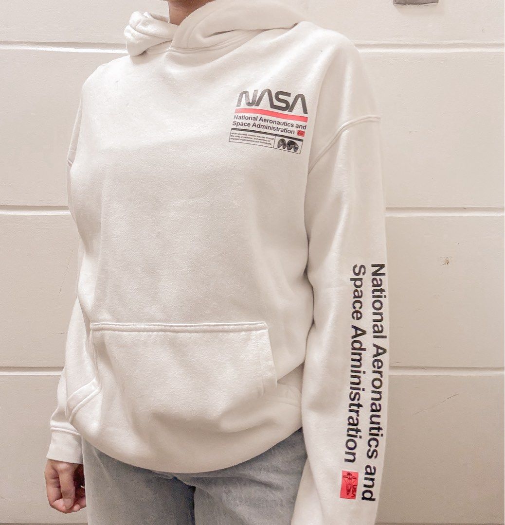 H&M White NASA Hoodie (Category: Hoodies) located in Manila. Submitted by jemmmandes (Listing ID 1460561313, Image 1). Description: - White hoodie by H&M - with ballpen marks.