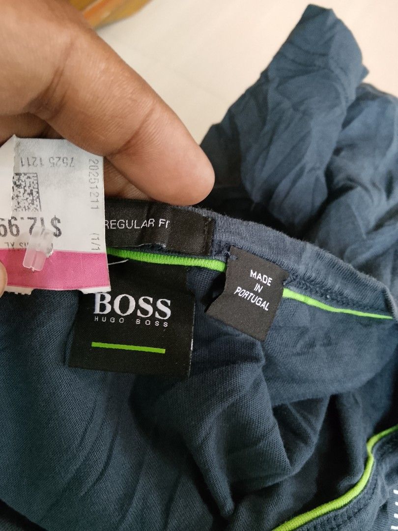 Hugo Boss Regular Fit T-Shirt (Category: Tshirts & Polo Shirts ) located in Manila. Submitted by arjaygoodfind (Listing ID 1460597389, Image 3). Description: - Brand: Hugo Boss - Color: Dark Blue - Fit: Regular - Origin: Made in Portugal - Features: Graphic print on the front - Occasion: Casual wear - Condition: Please check photos for details.
