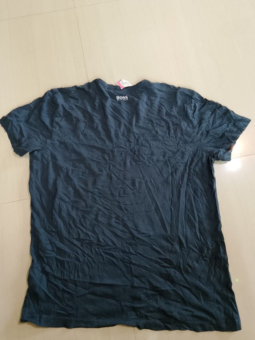 Hugo Boss Regular Fit T-Shirt (Category: Tshirts & Polo Shirts ) located in Manila. Submitted by arjaygoodfind (Listing ID 1460597389, Image 2). Description: - Brand: Hugo Boss - Color: Dark Blue - Fit: Regular - Origin: Made in Portugal - Features: Graphic print on the front - Occasion: Casual wear - Condition: Please check photos for details.