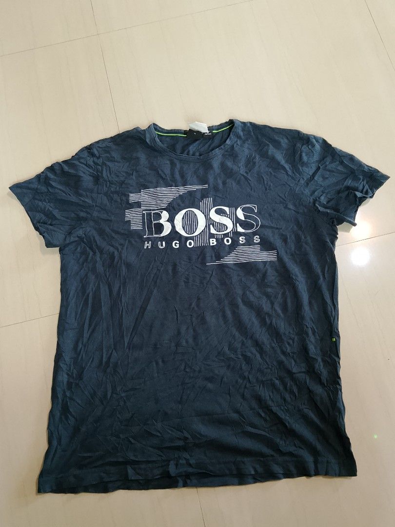 Hugo Boss Regular Fit T-Shirt (Category: Tshirts & Polo Shirts ) located in Manila. Submitted by arjaygoodfind (Listing ID 1460597389, Image 1). Description: - Brand: Hugo Boss - Color: Dark Blue - Fit: Regular - Origin: Made in Portugal - Features: Graphic print on the front - Occasion: Casual wear - Condition: Please check photos for details.