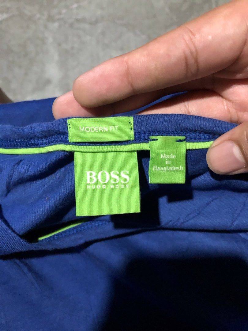 Hugo Boss shirt (Category: Formal Shirts) located in Santa Catalina. Submitted by marlonsecondclosett (Listing ID 1460642539, Image 3). Description: This is a blue Hugo Boss crew neck short sleeve T-shirt with a subtle tonal graphic logo on the chest and a bright green neck label detail..