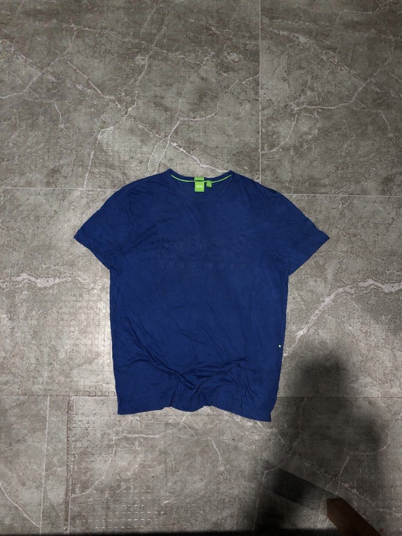 Hugo Boss shirt (Category: Formal Shirts) located in Santa Catalina. Submitted by marlonsecondclosett (Listing ID 1460642539, Image 2). Description: This is a blue Hugo Boss crew neck short sleeve T-shirt with a subtle tonal graphic logo on the chest and a bright green neck label detail..