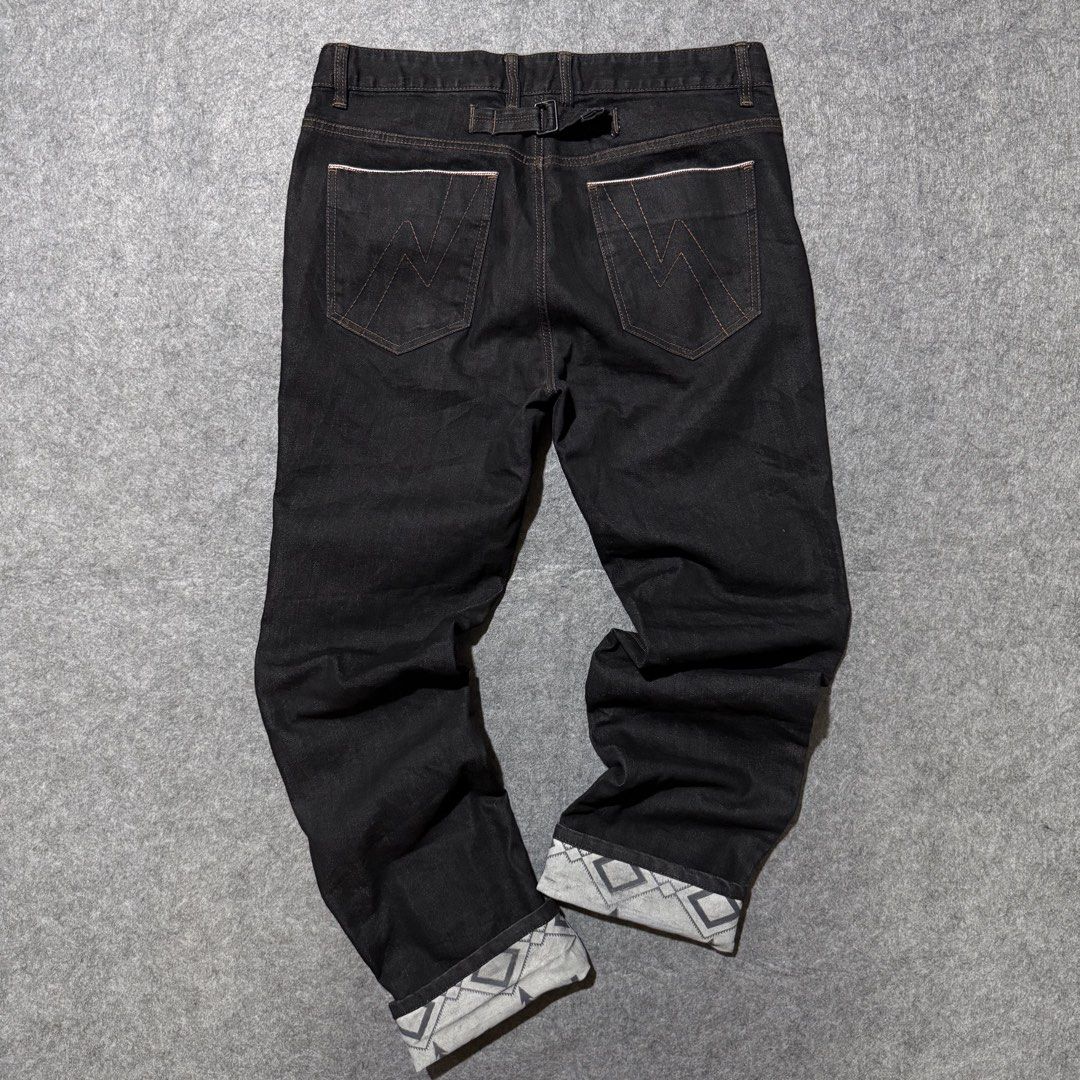 Hum selvedge panta (Category: Jeans) located in Zamboanga. Submitted by arganhadjula28 (Listing ID 1460631453, Image 2). Description: black denim jeans featuring distinctive geometric patterned cuffs and a cinch-back adjuster. Waistline 34 Length 45 Hem 8.