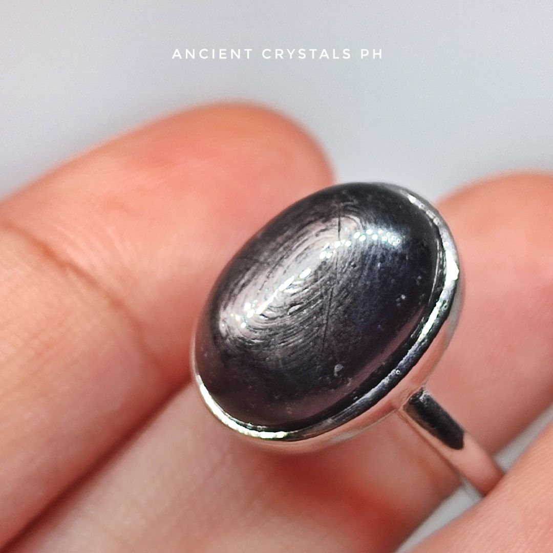 Hypersthene Ring ~ “Aura” 🖤 (Category: Rings) located in Makati City. Submitted by ancientph (Listing ID 1460666564, Image 2). Description: Hypersthene Ring ~ “Aura” 🖤 From the Power Within Collection Good for: -Enhances grounding -Boosts intuition -Soothes anxiety -Promotes clarity °•°•°•°•°• Type: Adjustable ring from size 4-8 Material: silver plated alloy Color: silver Price: 400 Mode of Payment: Gcash, Maribank, Unionbank, BPI Courier: Move