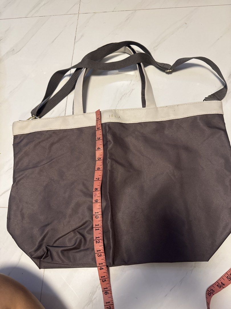 IENA Tote Bag (Category: Tote Bags) located in Silang. Submitted by sari2bilina (Listing ID 1460667154, Image 1). Description: - Stylish grey tote bag with elegant cream trim. - Features the embossed 'IENA' brand name on the trim. - Comes with two comfortable top handles. - Includes a long, adjustable strap for versatile carrying options. - Generously sized for all your essentials: approx. 38cm Height x 45cm Width..