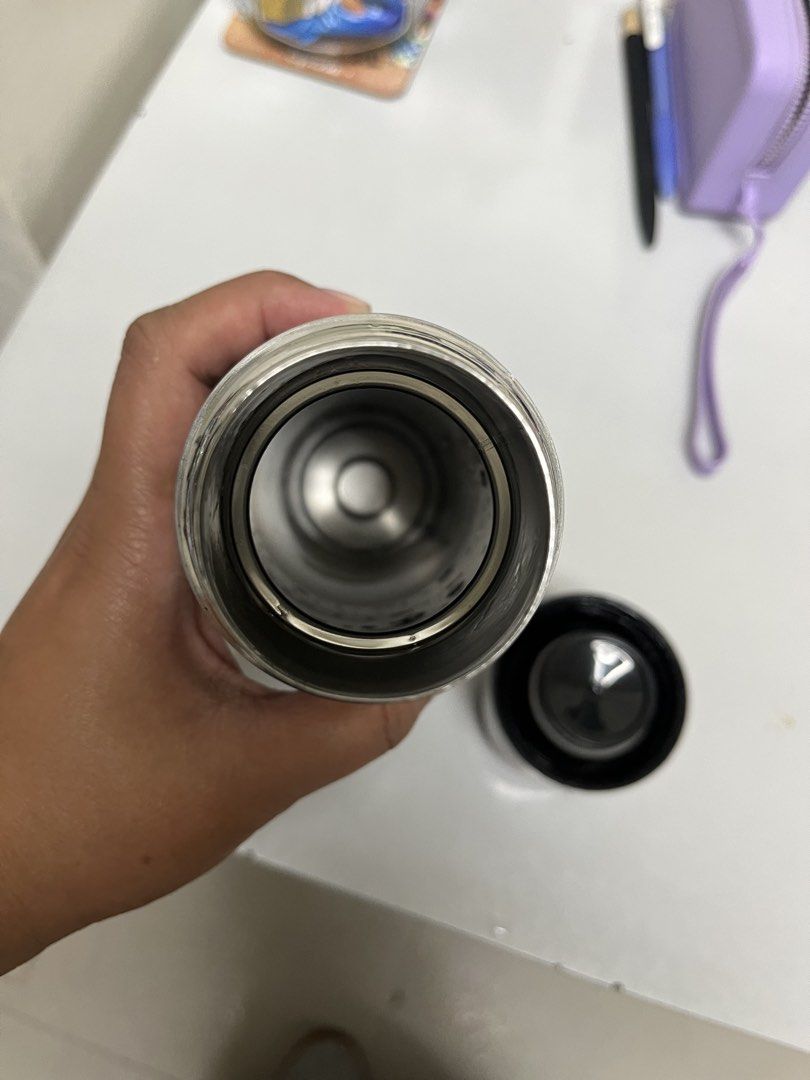Imarflex Thermos Flask (Category: Water Bottles & Tumblers) located in Manila. Submitted by closetperfection (Listing ID 1460665413, Image 1). Description: - imarflex (Sta. Lucia Mall) branded thermos flask - Color: Dark grey/black with a wavy design - Material: Stainless steel interior and cap - Functionality: Keeps drinks hot or cold - Condition: Clean inside, ready for a new owner.