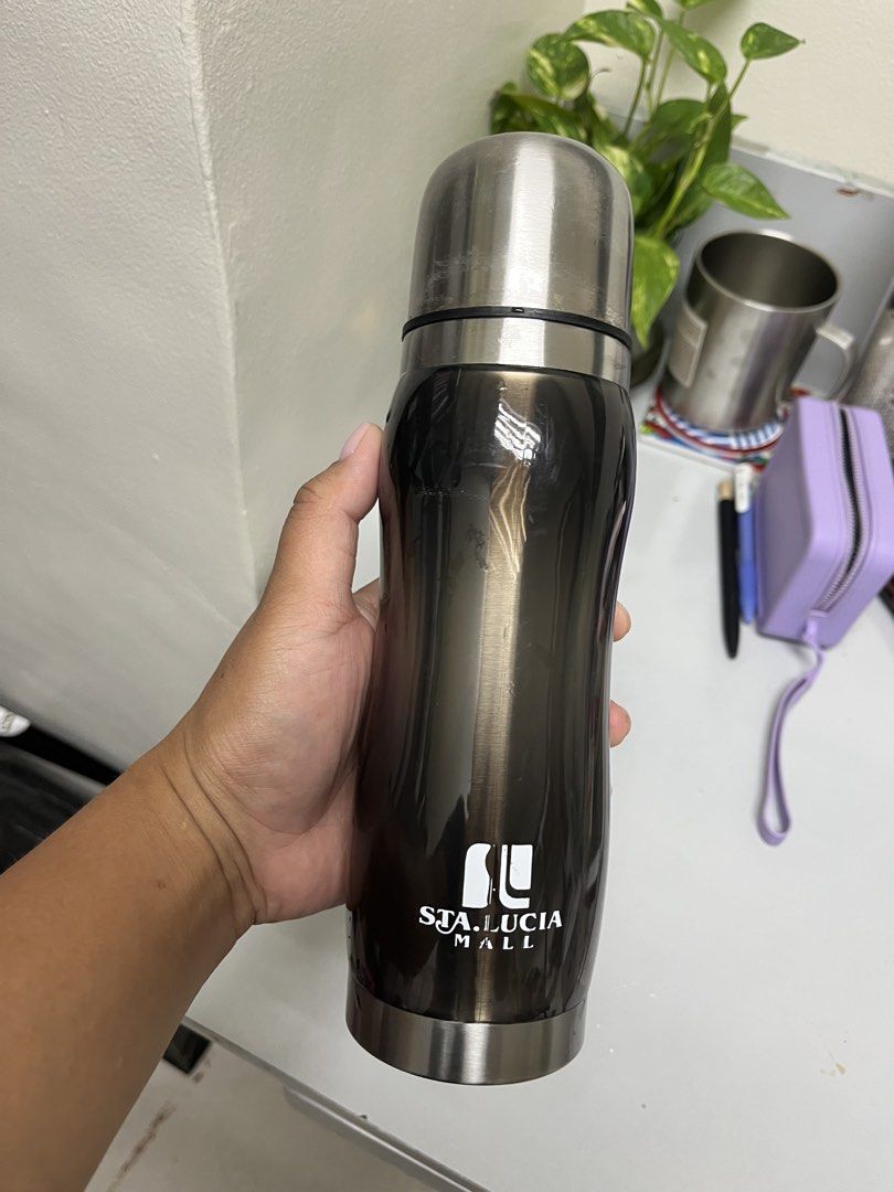Imarflex Thermos Flask (Category: Water Bottles & Tumblers) located in Manila. Submitted by closetperfection (Listing ID 1460665413, Image 3). Description: - imarflex (Sta. Lucia Mall) branded thermos flask - Color: Dark grey/black with a wavy design - Material: Stainless steel interior and cap - Functionality: Keeps drinks hot or cold - Condition: Clean inside, ready for a new owner.