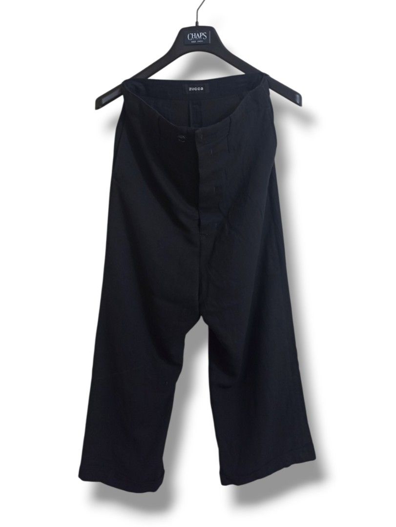 ISSEY MIYAKE "ZUCCA" (Category: Other Bottoms) located in Davao. Submitted by anythin6 (Listing ID 1460653551, Image 1). Description: - Classic black trousers from Zucca - Features a button closure for a secure fit - Two functional pockets on the back - Perfect for both casual and smart occasions.