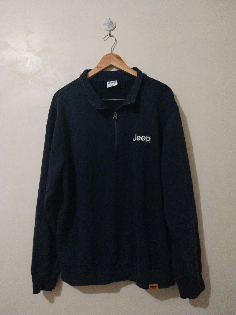 Jeep "Experience More" Quarter Zip Sweatshirt (Category: Coats, Jackets and Outerwear) located in Davao. Submitted by thegraildept2026 (Listing ID 1460696416, Image 1). Description: - Navy blue Jeep quarter zip sweatshirt - Embroidered "Jeep" logo on the chest - "Experience More" text with mountain graphic on the back - Relaxed fit for comfort - Ideal for casual outings or outdoor adventures.