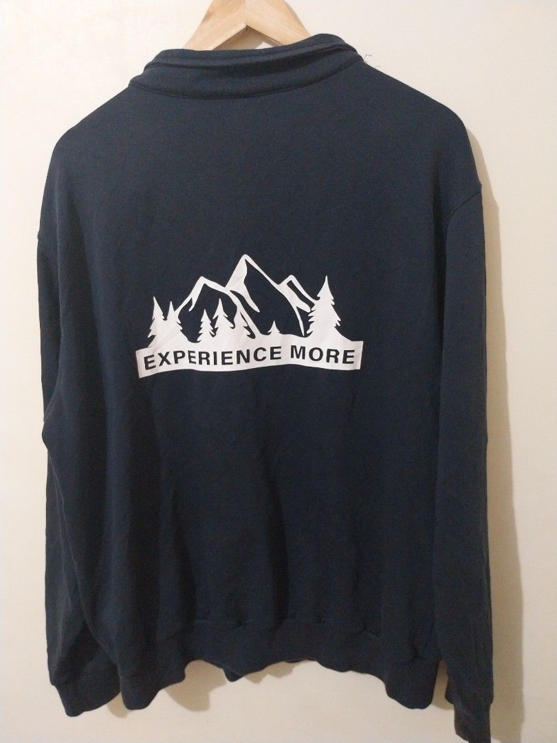 Jeep "Experience More" Quarter Zip Sweatshirt (Category: Coats, Jackets and Outerwear) located in Davao. Submitted by thegraildept2026 (Listing ID 1460696416, Image 2). Description: - Navy blue Jeep quarter zip sweatshirt - Embroidered "Jeep" logo on the chest - "Experience More" text with mountain graphic on the back - Relaxed fit for comfort - Ideal for casual outings or outdoor adventures.