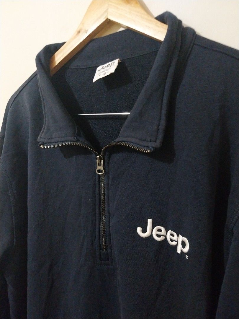 Jeep "Experience More" Quarter Zip Sweatshirt (Category: Coats, Jackets and Outerwear) located in Davao. Submitted by thegraildept2026 (Listing ID 1460696416, Image 3). Description: - Navy blue Jeep quarter zip sweatshirt - Embroidered "Jeep" logo on the chest - "Experience More" text with mountain graphic on the back - Relaxed fit for comfort - Ideal for casual outings or outdoor adventures.