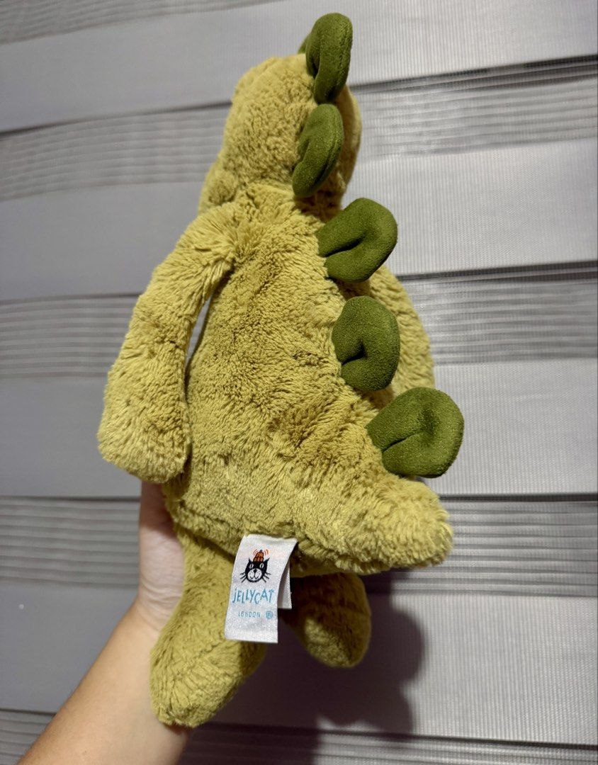 Jellycat Bashful Dino Medium (Category: Plushies & Soft Toys) located in Manila. Submitted by bcbg3217 (Listing ID 1460700520, Image 2). Description: ‼️PLEASE READ BEFORE BUYING‼️ Like new condition Medium size Super soft fur Authenticity NOT guaranteed (Please do your own checking too) No other jellycat inclusions Actual photos are posted No other issues or flaws unless stated Please check the photos thoroughly before placing an order JnT regula