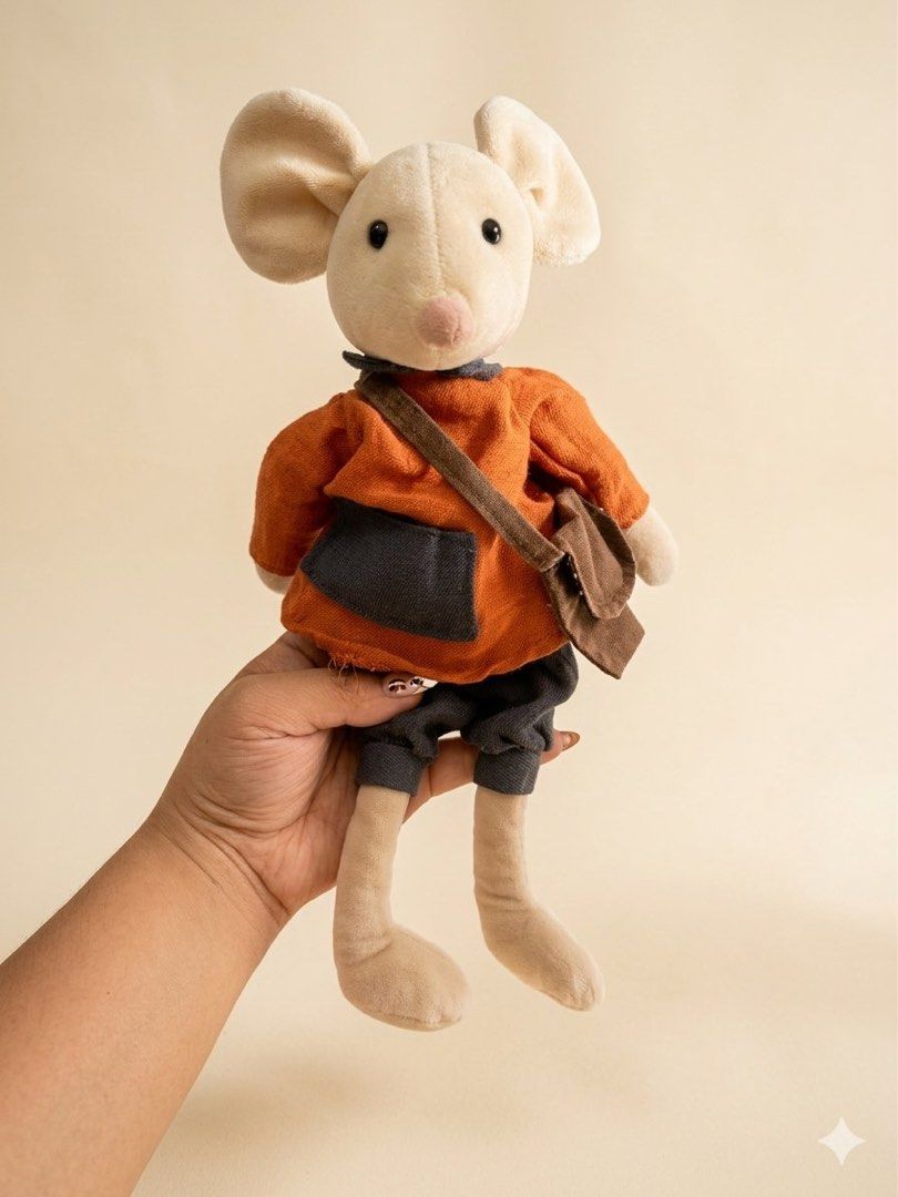 Jellycat Mouse Plush Toy with Bag (Category: Plushies & Soft Toys) located in Baguio. Submitted by cherylcaps95 (Listing ID 1460510122, Image 1). Description: - Adorable Jellycat mouse plush - Features an orange shirt and grey pants - Comes with a cute brown satchel bag - Ideal for Jellycat collectors - Makes a perfect gift - Exceptionally soft and cuddly - Ready to find its new home.