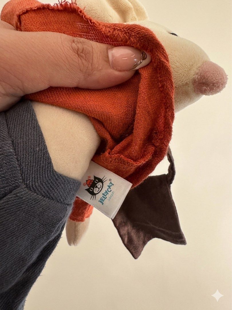Jellycat Mouse Plush Toy with Bag (Category: Plushies & Soft Toys) located in Baguio. Submitted by cherylcaps95 (Listing ID 1460510122, Image 3). Description: - Adorable Jellycat mouse plush - Features an orange shirt and grey pants - Comes with a cute brown satchel bag - Ideal for Jellycat collectors - Makes a perfect gift - Exceptionally soft and cuddly - Ready to find its new home.